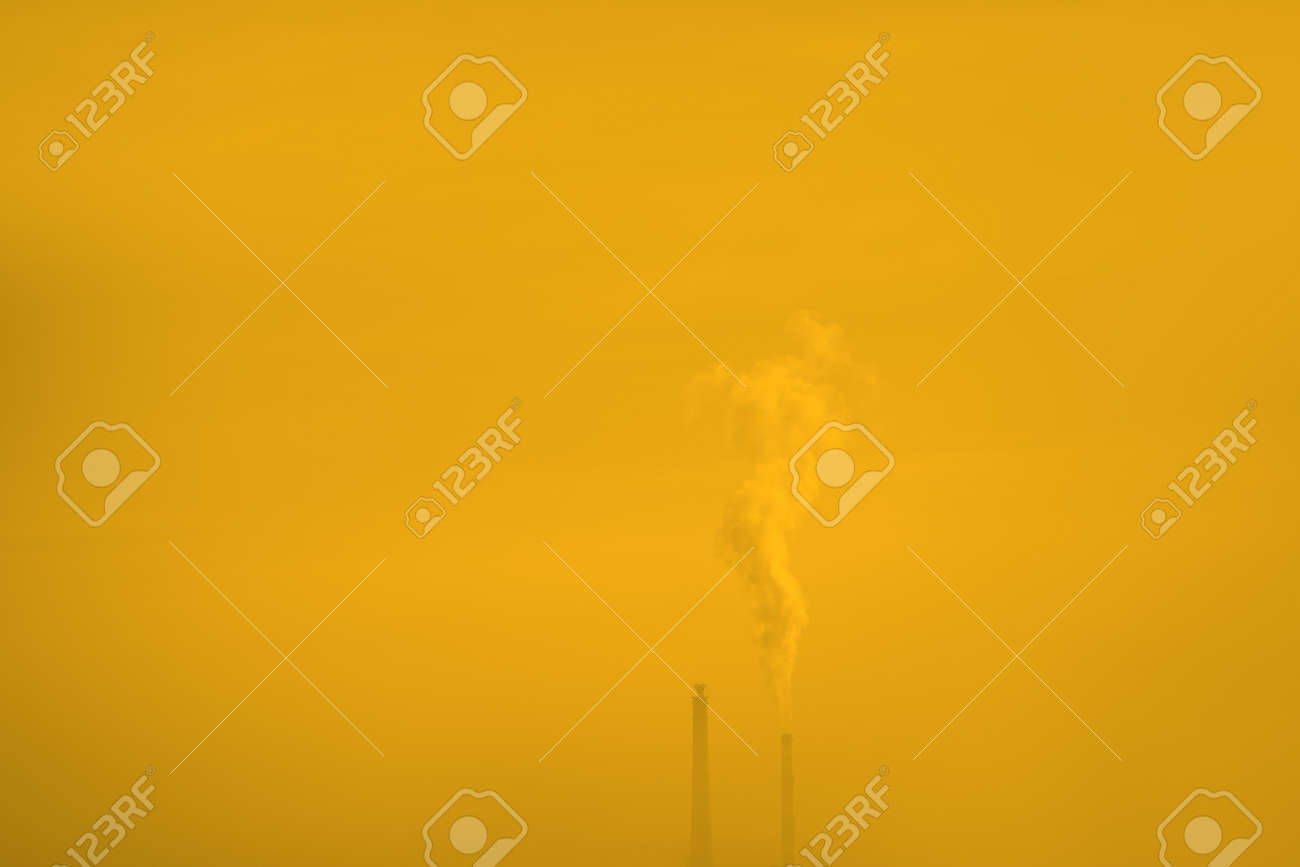 Industrial chimney in yellow fog . Smoke Coming Out from an Industrial Chemical Plant . Global warming concept - 167986839 Industrial chimney in yellow fog . Smoke Coming Out from an Industrial Chemical Plant . Global warming concept - 167986839