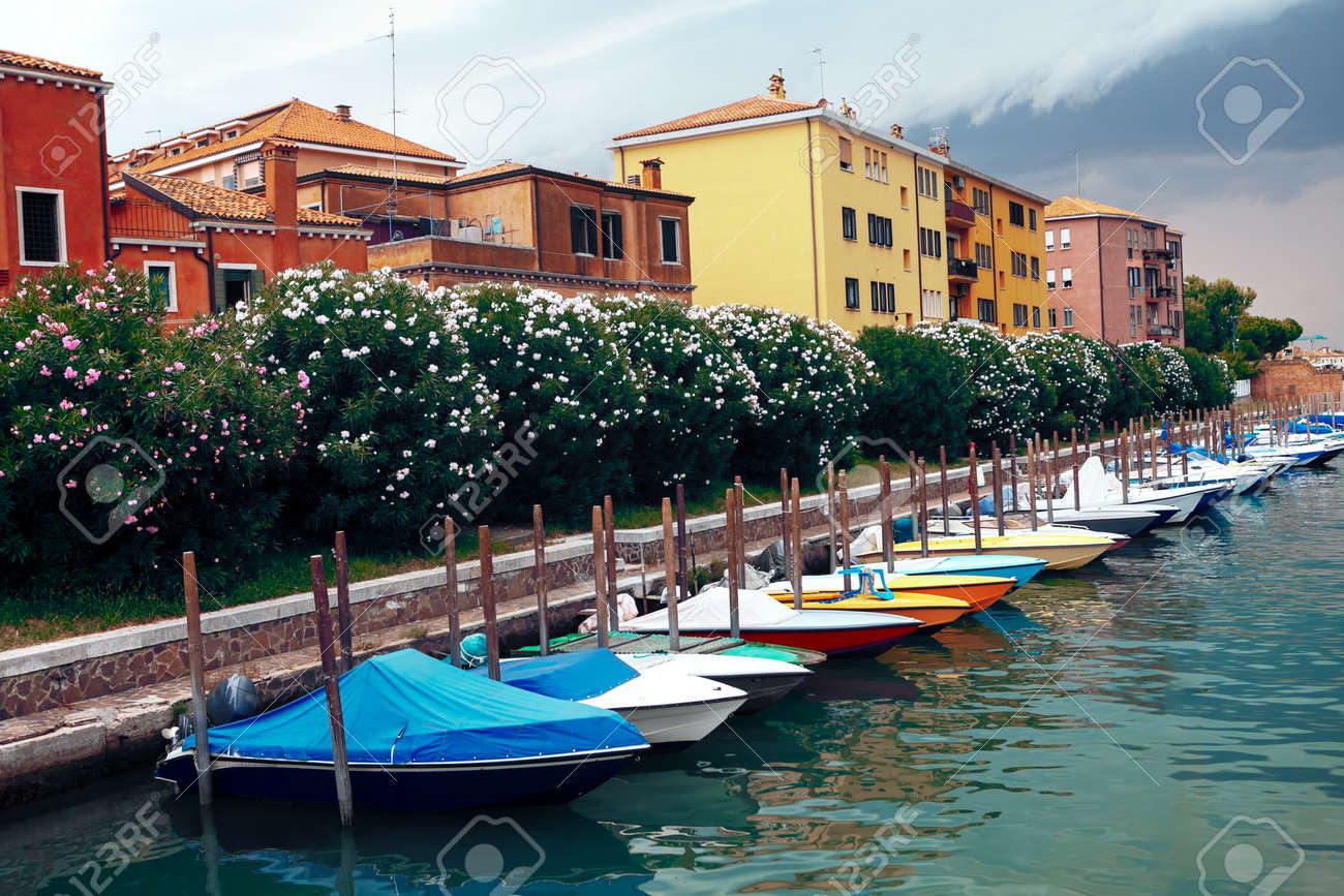 Row of moored boats . Coastal residential district in Venice - 167986898 Row of moored boats . Coastal residential district in Venice - 167986898