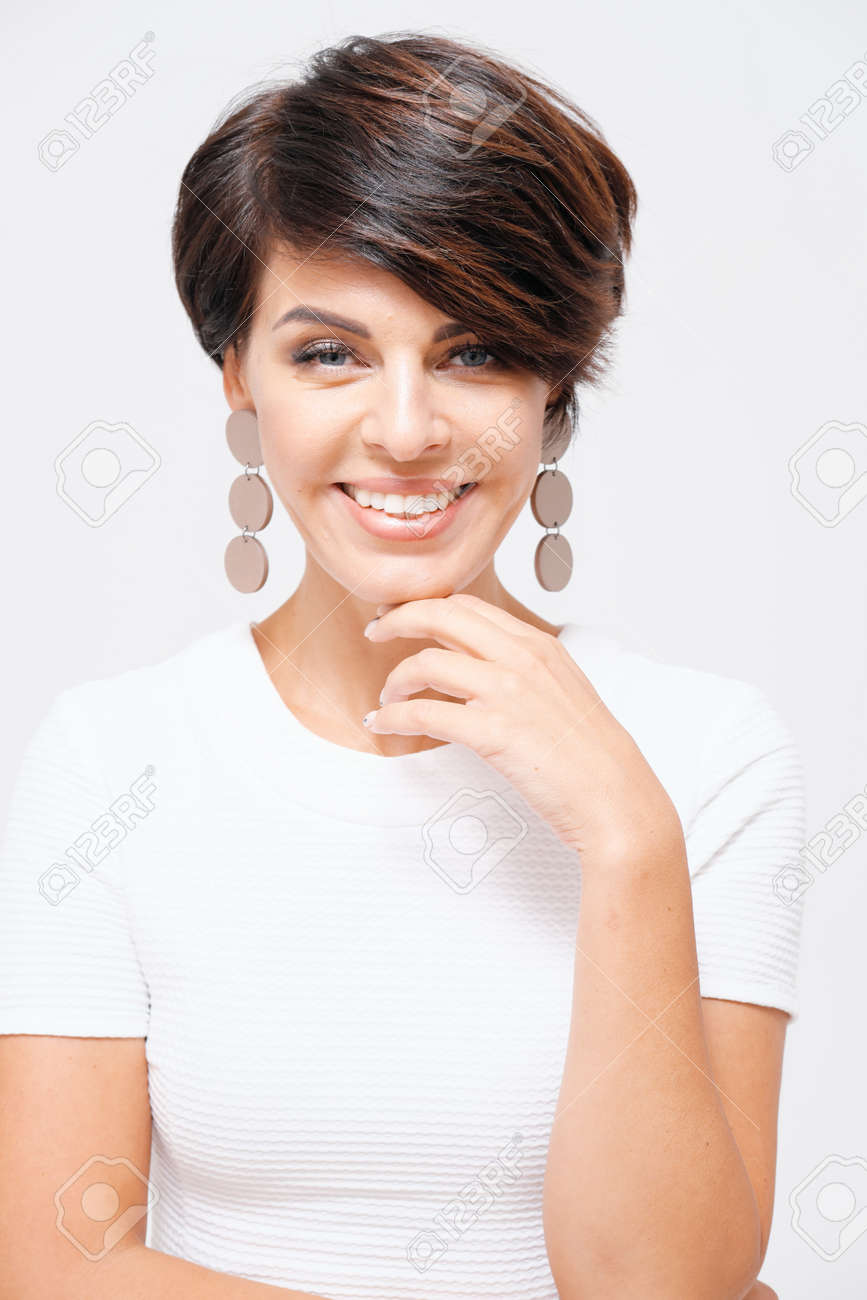 Studio Portrait Of Stylish Smiling Woman Age 35 40 Years In White Stock Photo Picture And Royalty Free Image Image