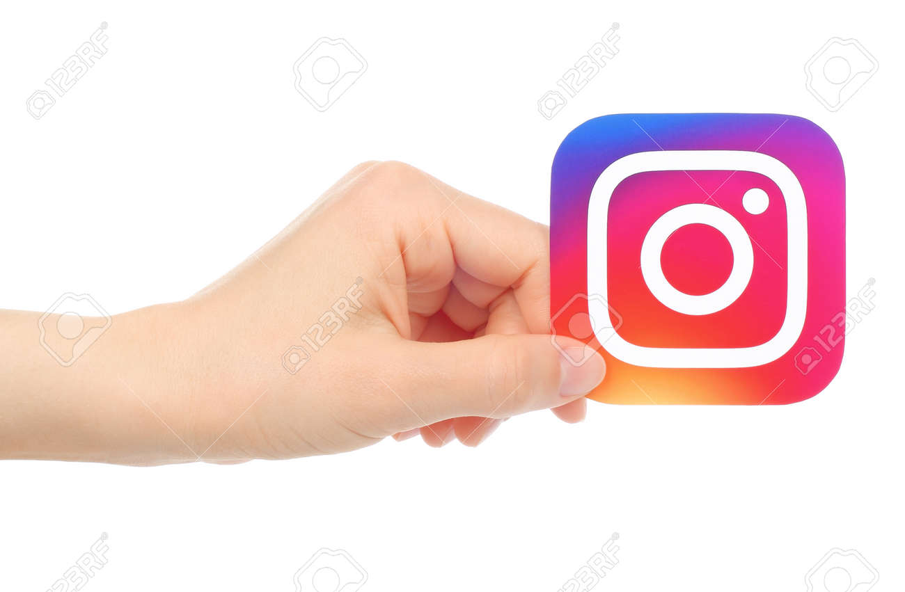 Kiev, Ukraine - May 18, 2016: Hand Holds New Instagram Logo Printed On  Paper, On White Background. Instagram Is An Online Mobile Photo-sharing,  Video-sharing Service. Stock Photo, Picture And Royalty Free Image.