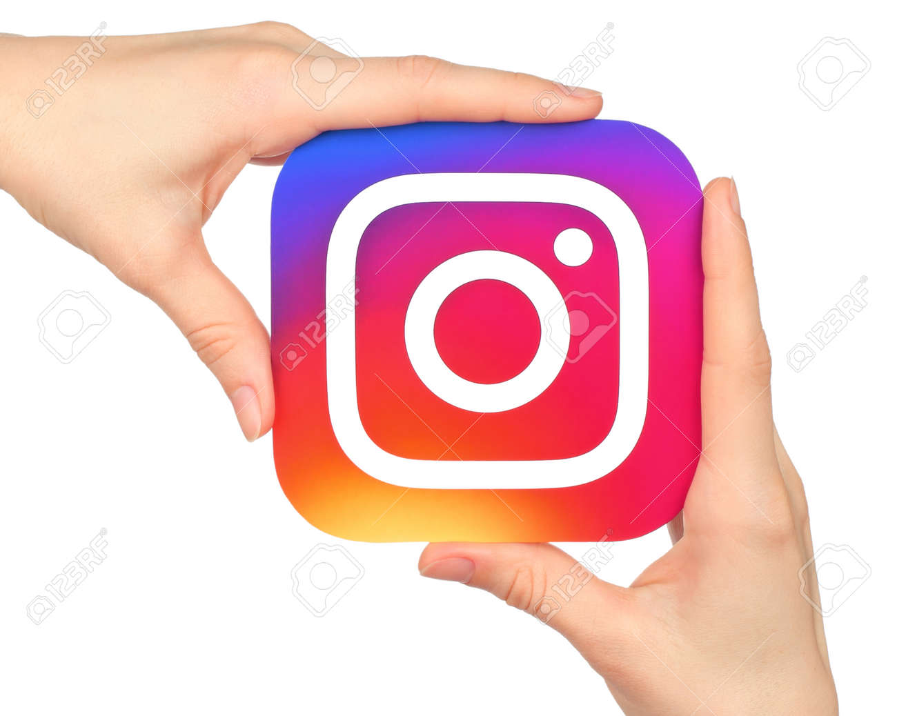 Kiev, Ukraine - January 20, 2016: Hands hold Instagram icon printed on paper. Instagram is an online mobile photo-sharing, video-sharing service - 80455285 Kiev, Ukraine - January 20, 2016: Hands hold Instagram icon printed on paper. Instagram is an online mobile photo-sharing, video-sharing service - 80455285