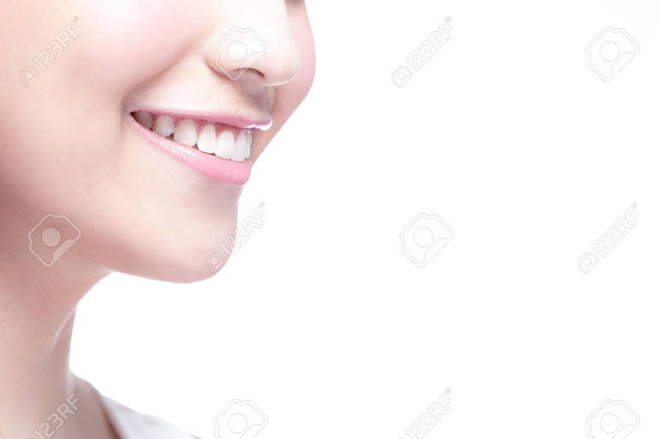 Beautiful young woman health teeth close up and charming smile. Isolated over white background - 44403524 Beautiful young woman health teeth close up and charming smile. Isolated over white background - 44403524