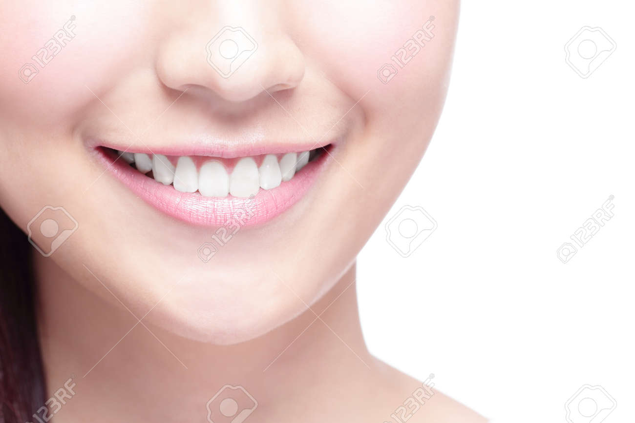 Beautiful young woman health teeth close up and charming smile. Isolated over white background, asian beauty - 48440866 Beautiful young woman health teeth close up and charming smile. Isolated over white background, asian beauty - 48440866
