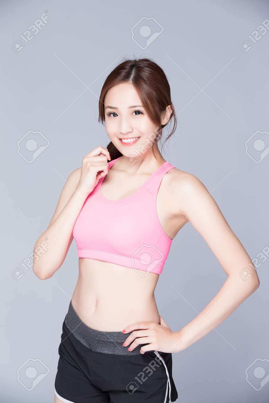 Sport girl isolated on gray background. Running fitness sport woman smiling happy. asian beauty - 57836425 Sport girl isolated on gray background. Running fitness sport woman smiling happy. asian beauty - 57836425