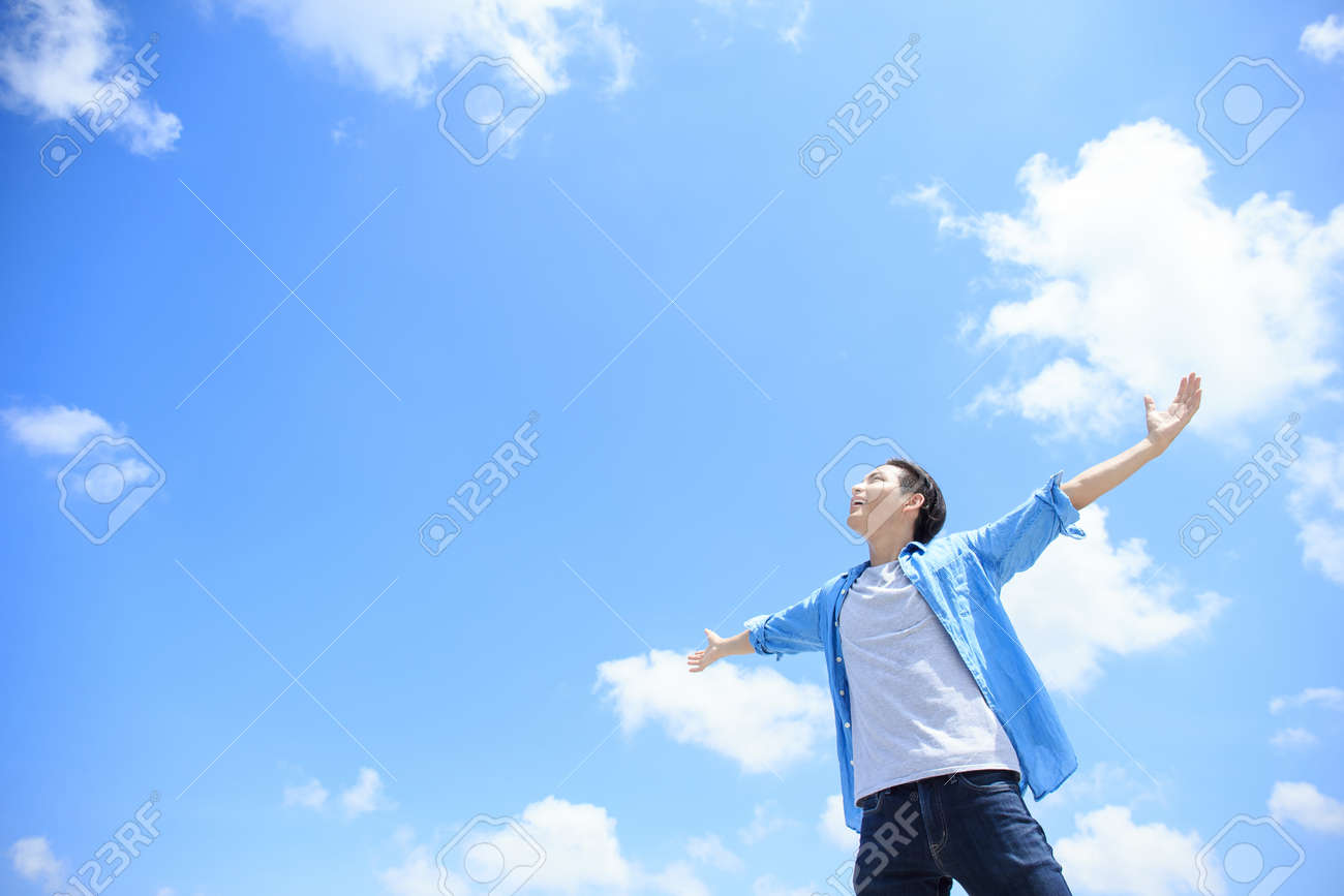 Carefree and free man raised hands and looking to a sky, asian - 59199939 Carefree and free man raised hands and looking to a sky, asian - 59199939