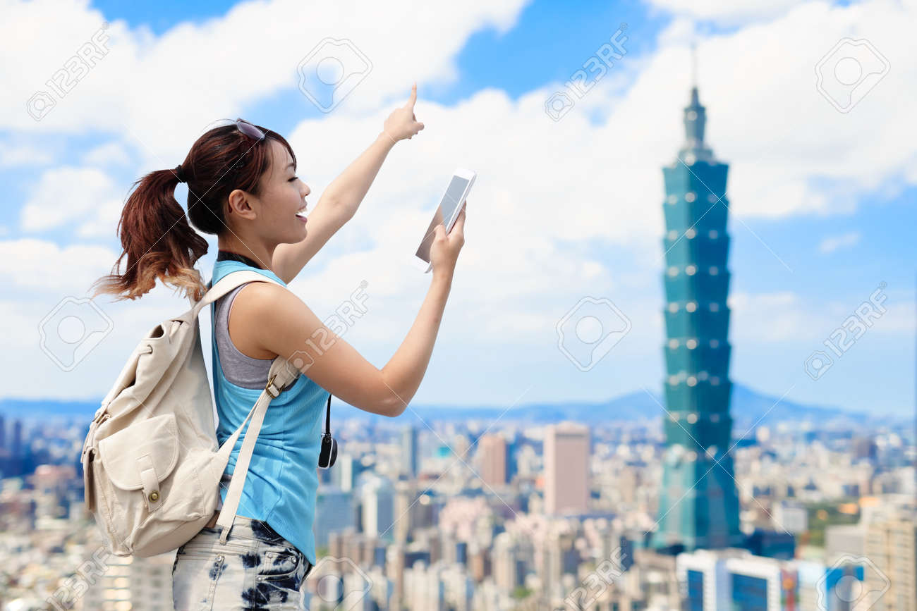 woman take phone and show something in the taipei - 88088033 woman take phone and show something in the taipei - 88088033