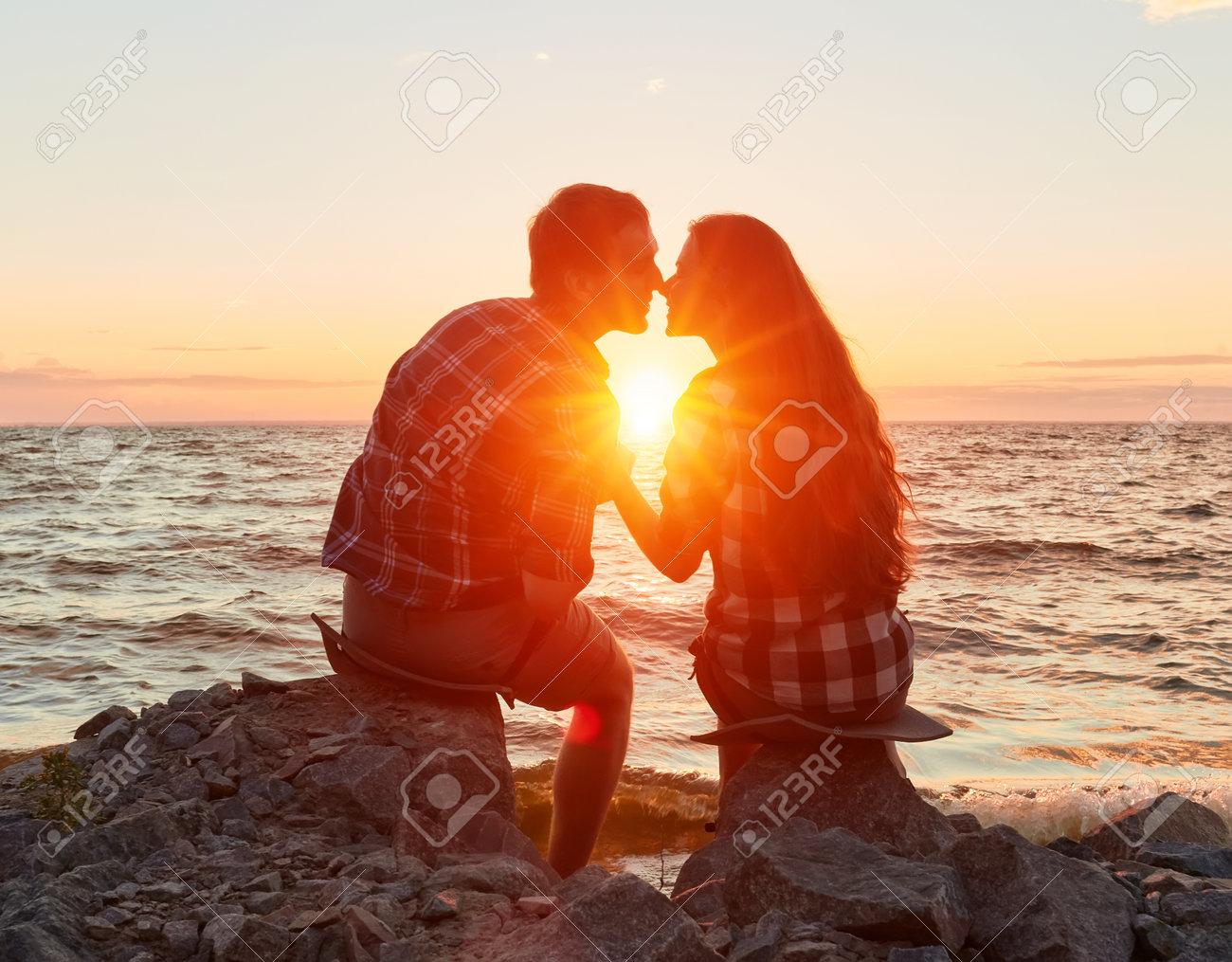 he and she on a nature outing. Romance and love.kiss in the sunset sun - 170687638 he and she on a nature outing. Romance and love.kiss in the sunset sun - 170687638