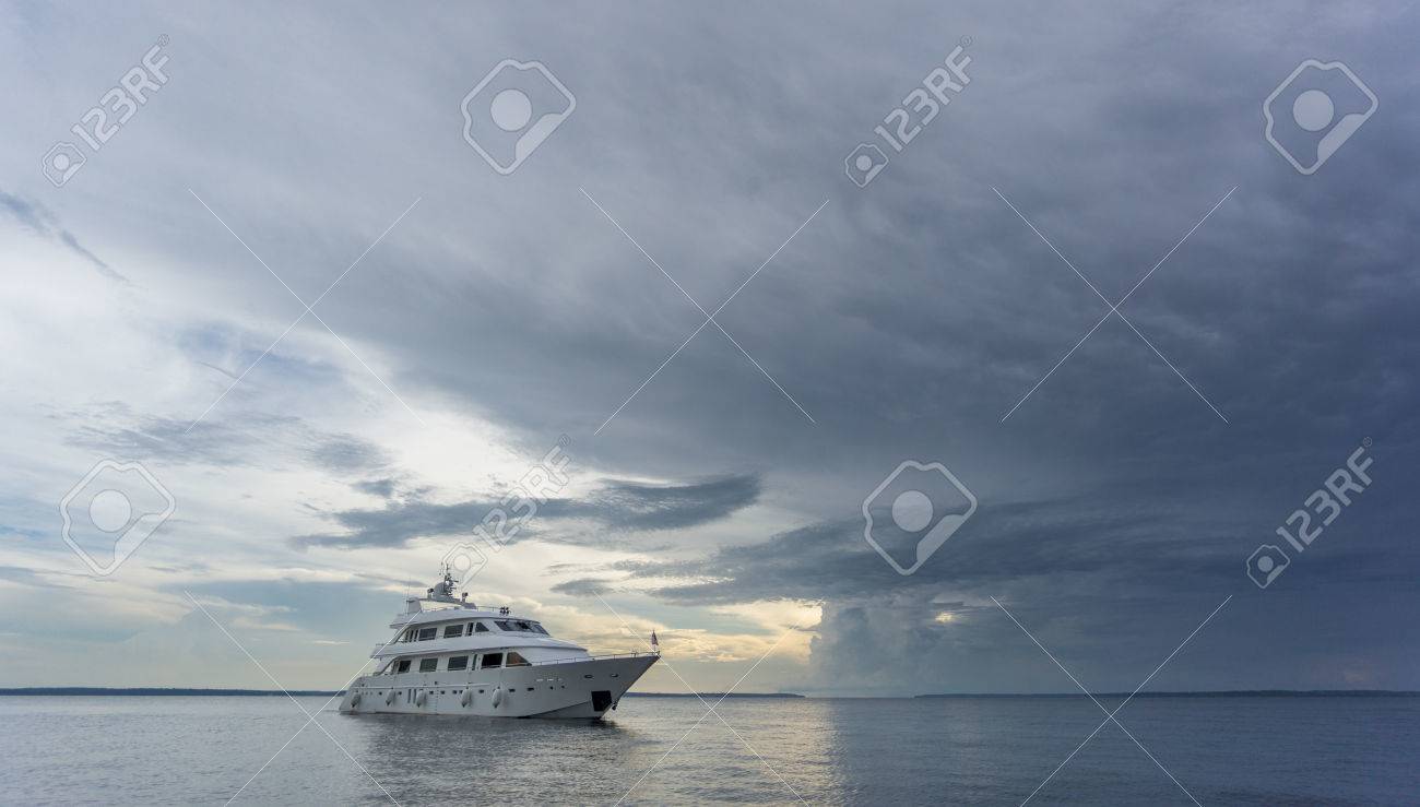 boat entering storm with calm water stock photo picture and royalty
