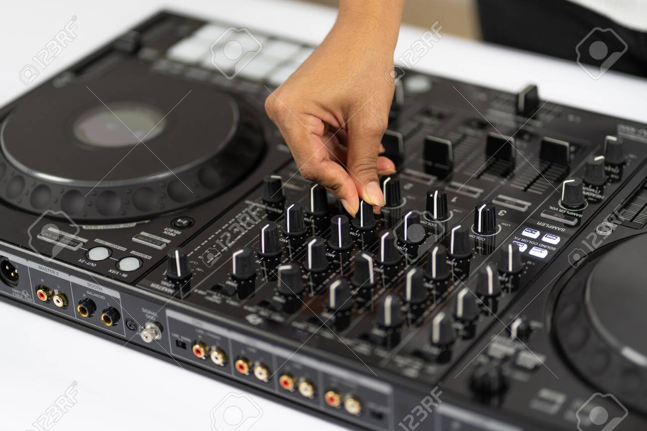Hands Of Dj Mixing Tracks On Professional Dj Mixer Stock Photo Picture And Royalty Free Image Image 135613009