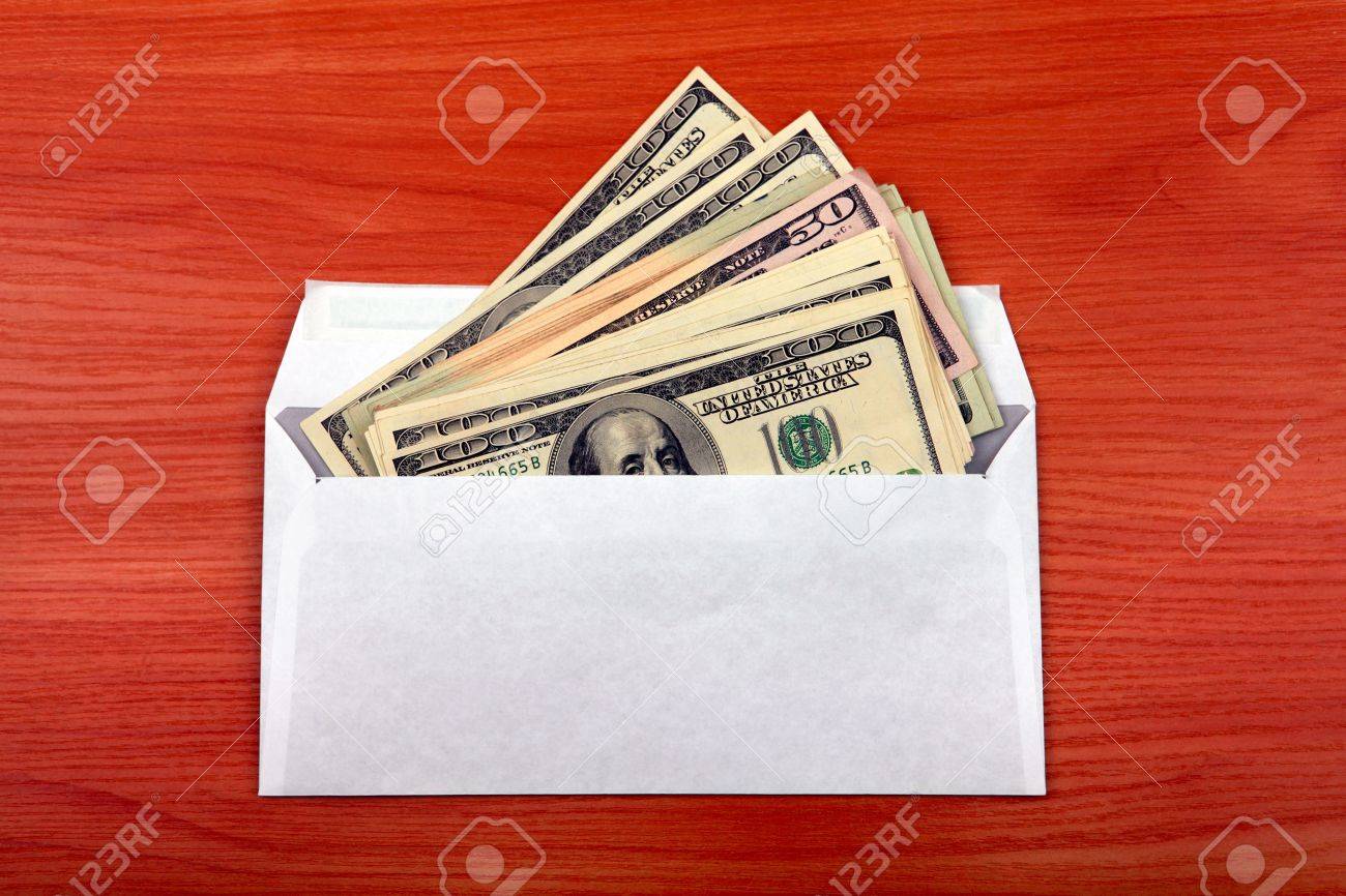 envelope with money lying on the table envelope with money