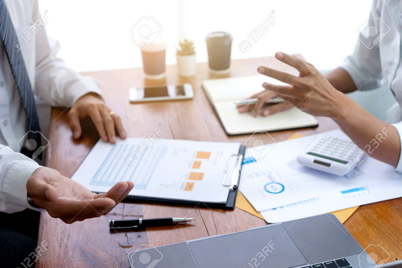 Sale representative or insurance broker offer house purchase contract to buy a house or apartment and give home key chain to customer - 169322417 Sale representative or insurance broker offer house purchase contract to buy a house or apartment and give home key chain to customer - 169322417