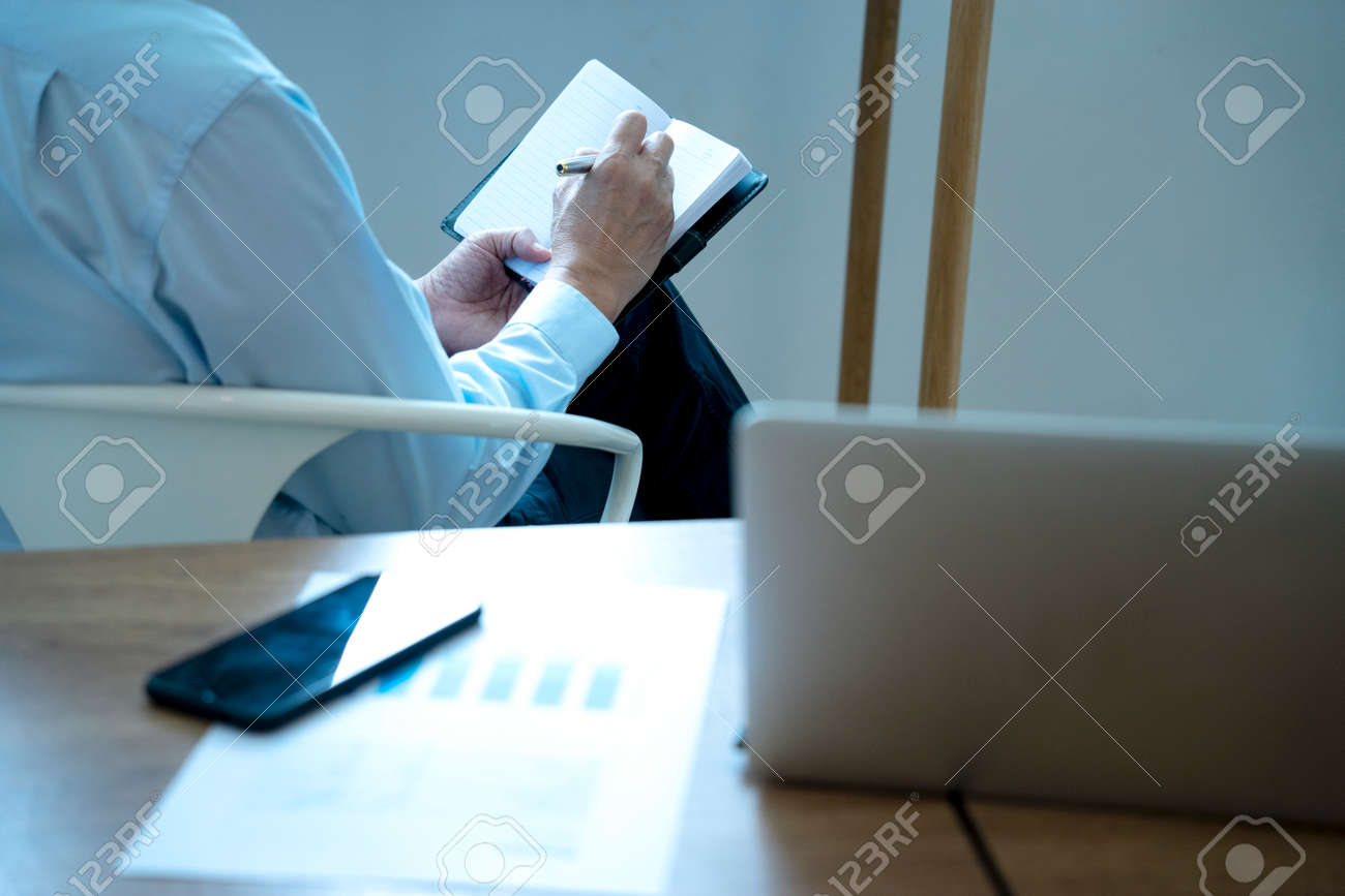 Smart businessman executive ceo or manager sitting thinking on a chair in the office his hand hold the pen with more copy space. - 169231315 Smart businessman executive ceo or manager sitting thinking on a chair in the office his hand hold the pen with more copy space. - 169231315