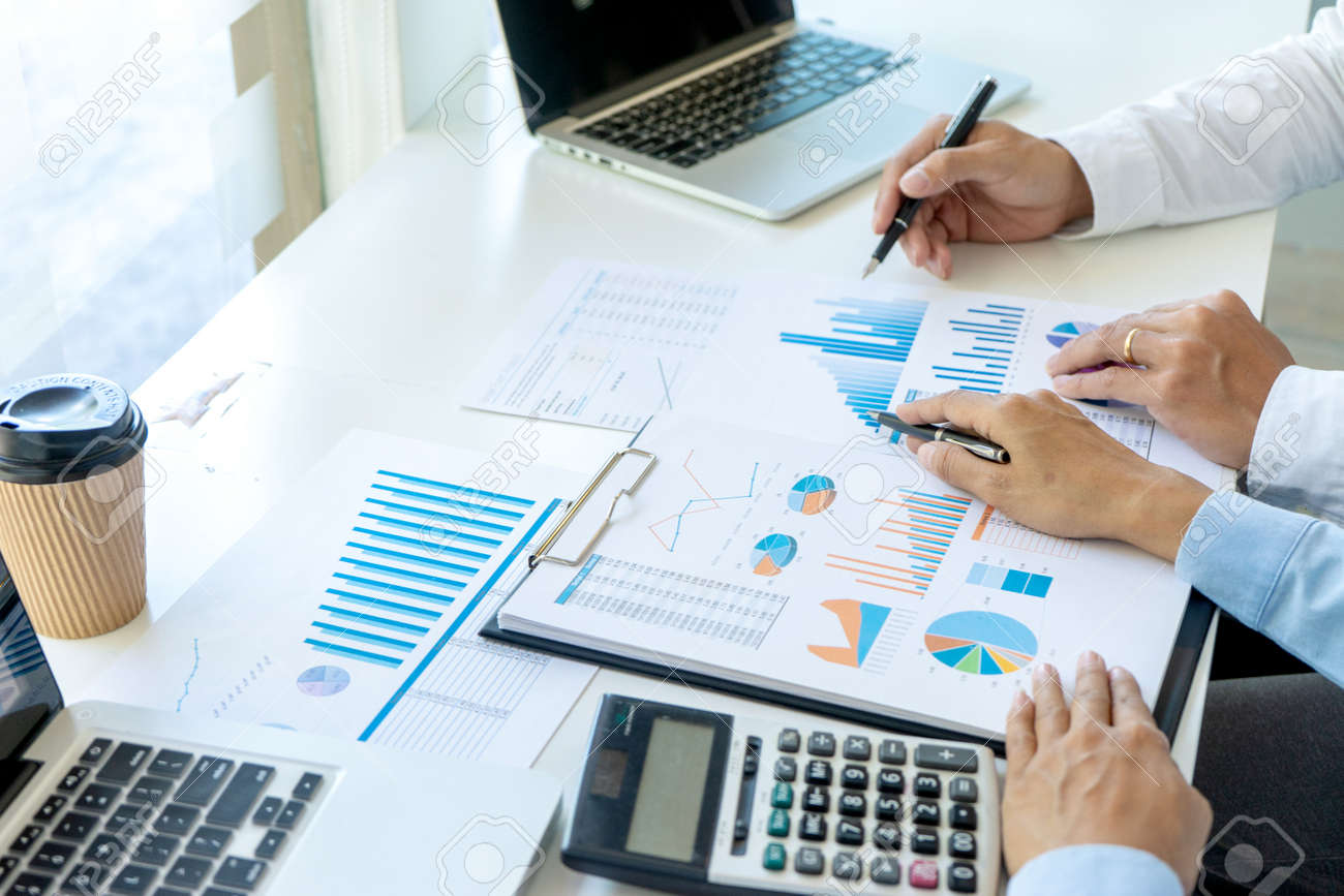 Businessman pointing at graphs paper of business in a graph analysis in office Marketing chart for marketing planning to generate sales - 169232048 Businessman pointing at graphs paper of business in a graph analysis in office Marketing chart for marketing planning to generate sales - 169232048