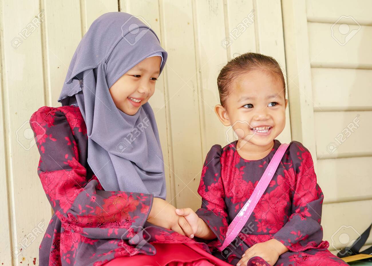 Portrait Of Two Siblings, Sister Handshaking Ask For Forgiveness