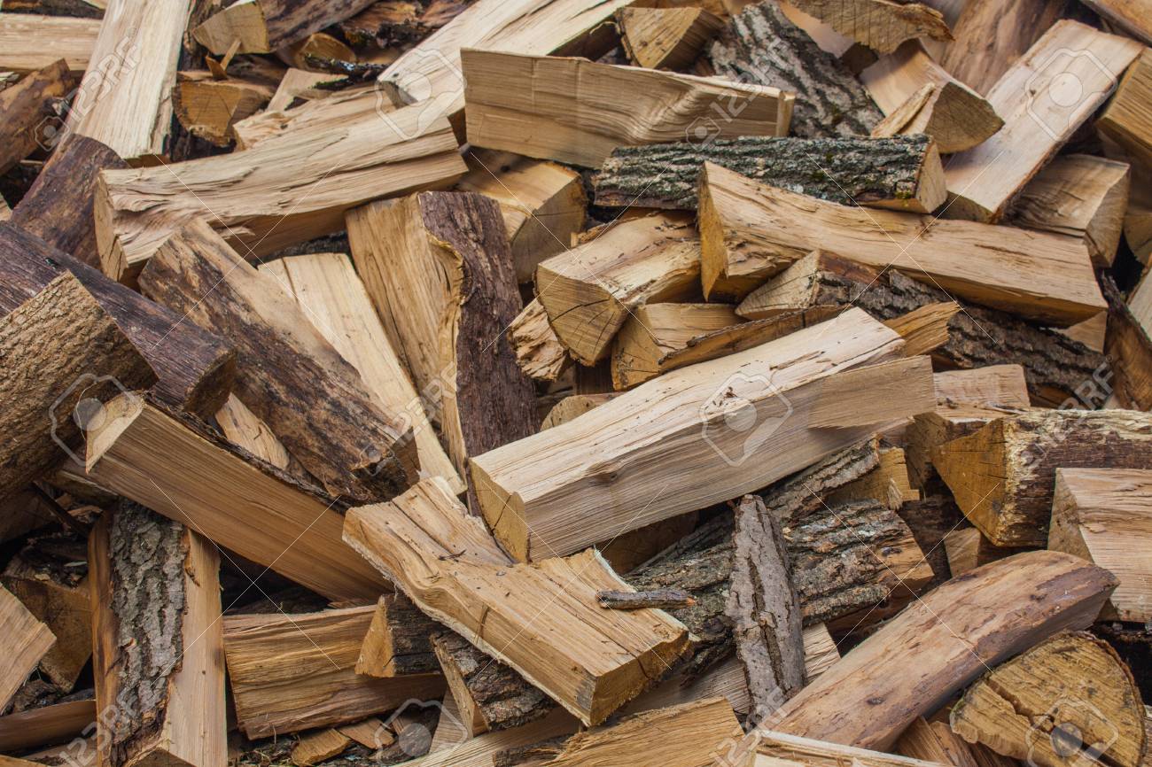 107510716-woodpile-of-chopped-lumber-pile-of-wood-logs-stacked-firewood-timber-.jpg