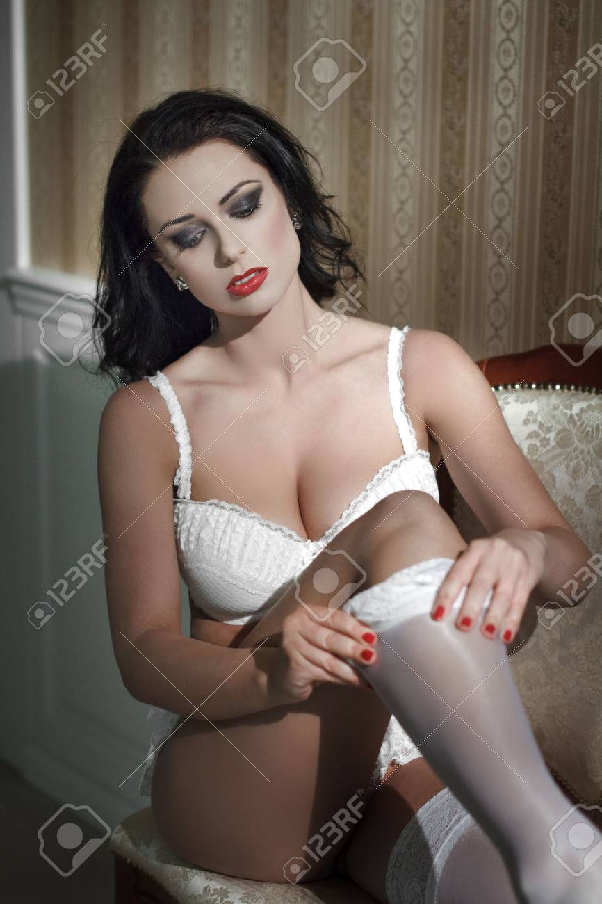 Sexy Woman Take Off White Stockings At