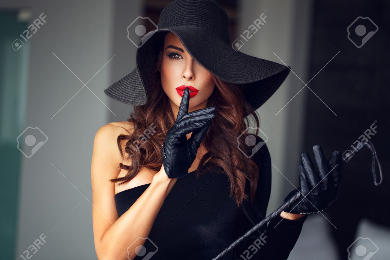 Sexy dominant woman in hat and whip showing no talk, - 52814340 Sexy dominant woman in hat and whip showing no talk, - 52814340