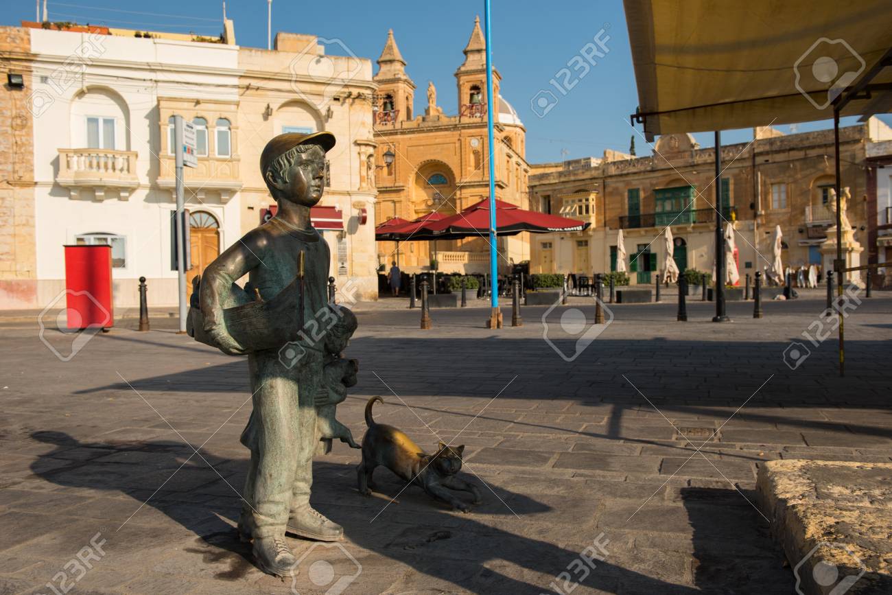 Marsaxlokk Malta August 23 2017 Bronze Statue Representing A Young Boy With A Cat At The Harbor Bay Of Marsaxlokk In Malta Island Stock Photo Picture And Royalty Free Image Image 85431325