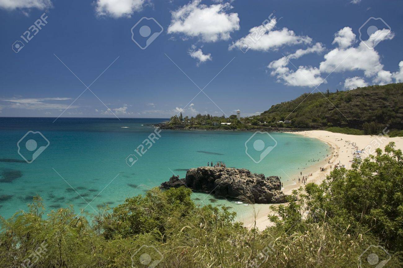 Crystal Clear Water And Big Lava Rock In A Sunny Day At The Waimea