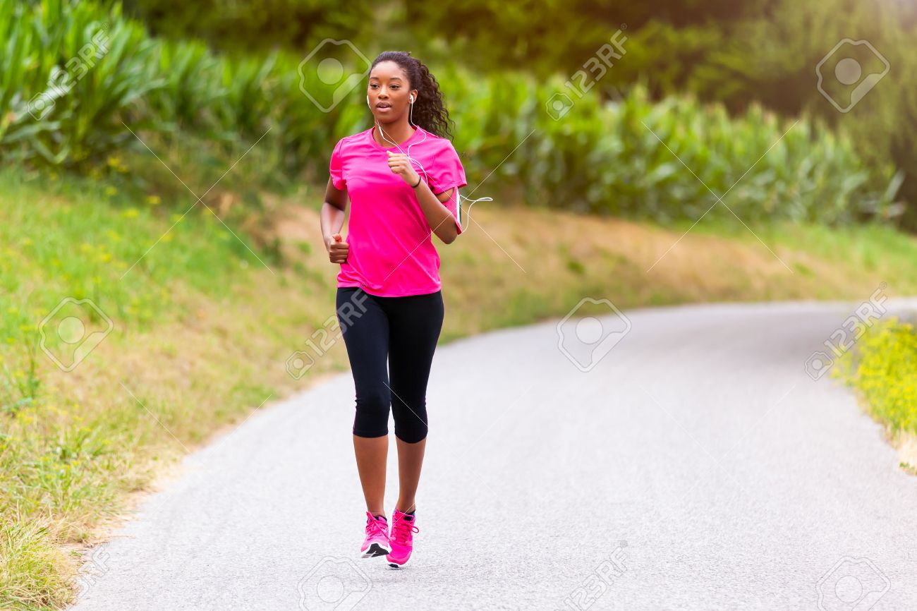 African american woman runner jogging outdoors - Fitness, people and healthy lifestyle - 43561066 African american woman runner jogging outdoors - Fitness, people and healthy lifestyle - 43561066