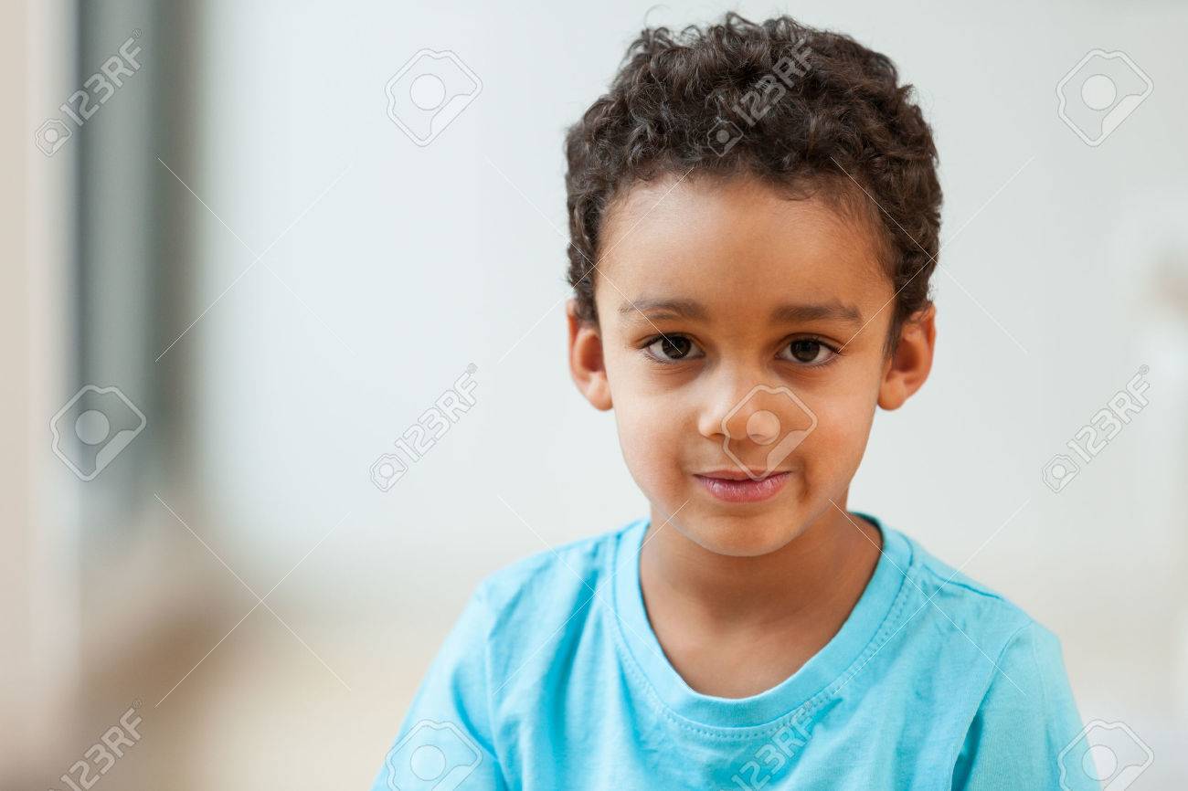 Portrait of a cute little African American boy smiling - 45736498 Portrait of a cute little African American boy smiling - 45736498