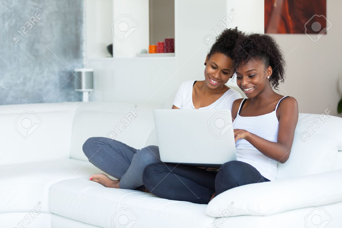 African American student girls using a laptop computer - black people - 46714012 African American student girls using a laptop computer - black people - 46714012