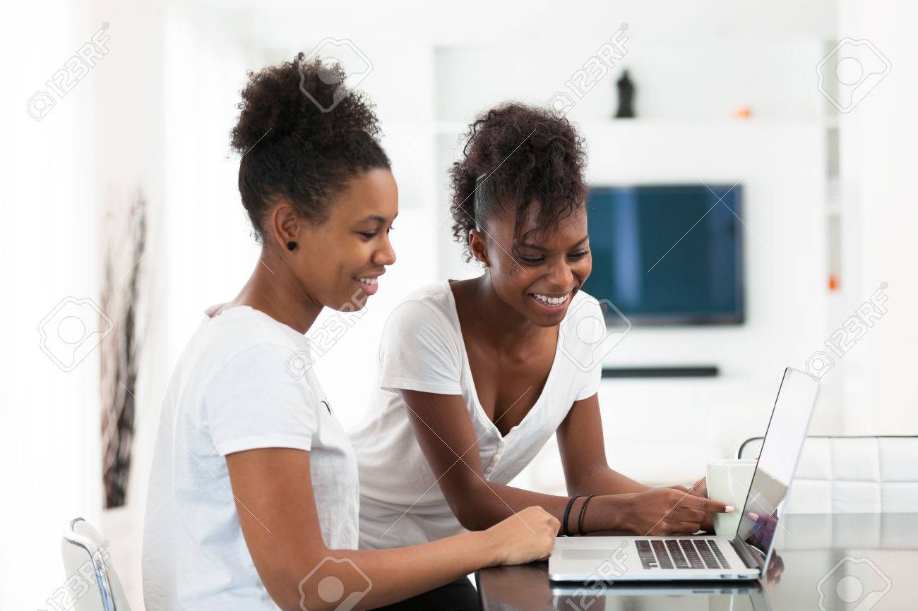 African American student girls using a laptop computer - black people - 46714009 African American student girls using a laptop computer - black people - 46714009
