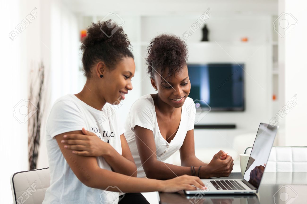 African American student girls using a laptop computer - black people - 46714028 African American student girls using a laptop computer - black people - 46714028