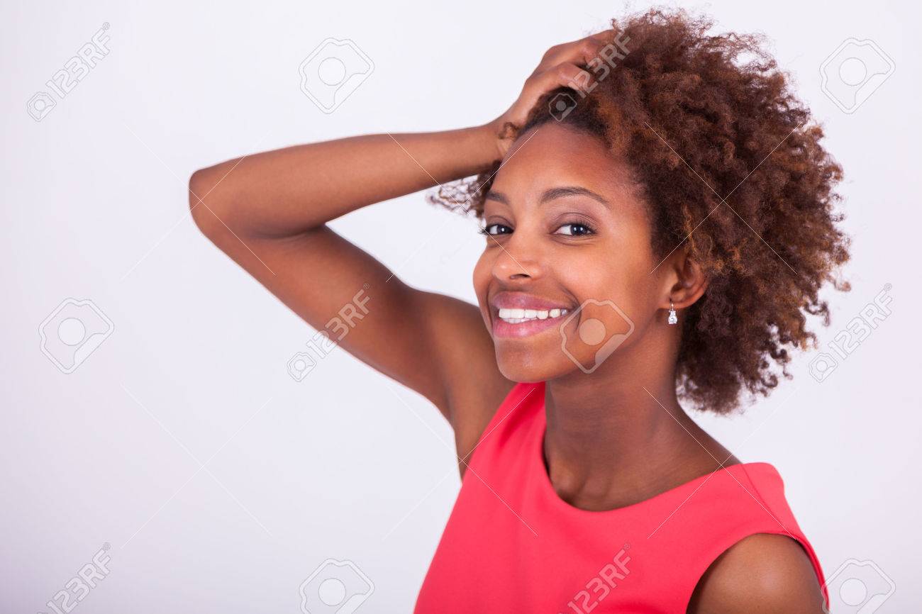 Young African American woman holding her frizzy afro hair - Black people - 58415835 Young African American woman holding her frizzy afro hair - Black people - 58415835