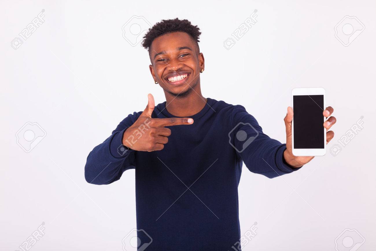 Young African American man pointing his smartphone screen - Black teenager people - 60347297 Young African American man pointing his smartphone screen - Black teenager people - 60347297