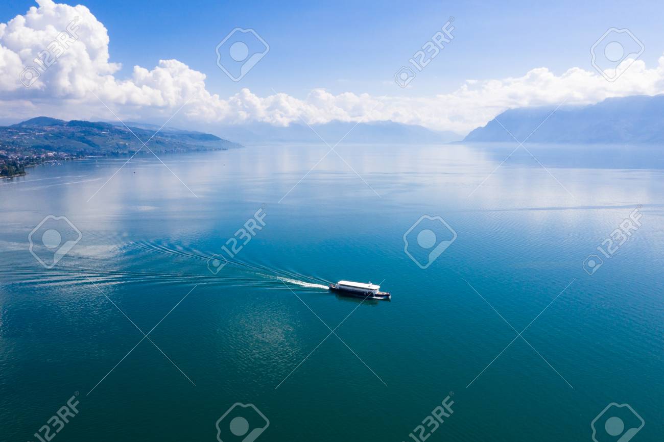 Aerial view of boat leaving Ouchy waterfront in Lausanne, Switzerland - 111831542 Aerial view of boat leaving Ouchy waterfront in Lausanne, Switzerland - 111831542