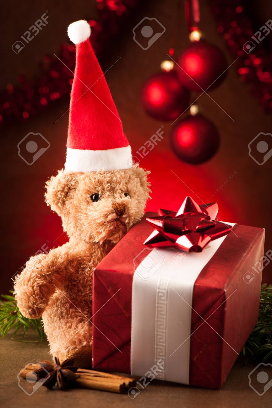 Teddy bear with red santa claus hat and christmas presents - 23160965 Teddy bear with red santa claus hat and christmas presents - 23160965
