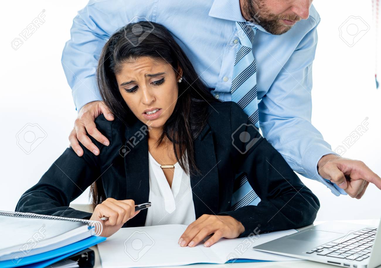 Uncomfortable Scared Woman Being Harass By Her Boss At Office In Sexual  Harassment At Work Place, Women Rights, Sexual Abuse Concept Isolated In  White Background. Stock Photo, Picture and Royalty Free Image.