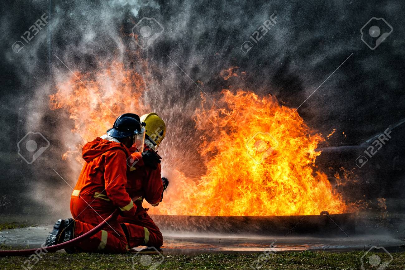 Firefighter Training Fireman Using Water And Extinguisher To Fighting With Fire Flame In An Emergency Situation Under Danger Situation All Firemen Wearing Fire Fighter Suit For Safety Stock Photo Picture And Royalty Firefighter Training Fireman Using Water And Extinguisher To Fighting With Fire Flame In An Emergency Situation Under Danger Situation All Firemen Wearing Fire Fighter Suit For Safety Stock Photo Picture And Royalty