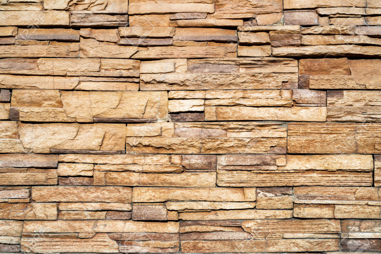 Wall of yellow stone. Abstract natural background. Uneven stone surface. - 168292037 Wall of yellow stone. Abstract natural background. Uneven stone surface. - 168292037