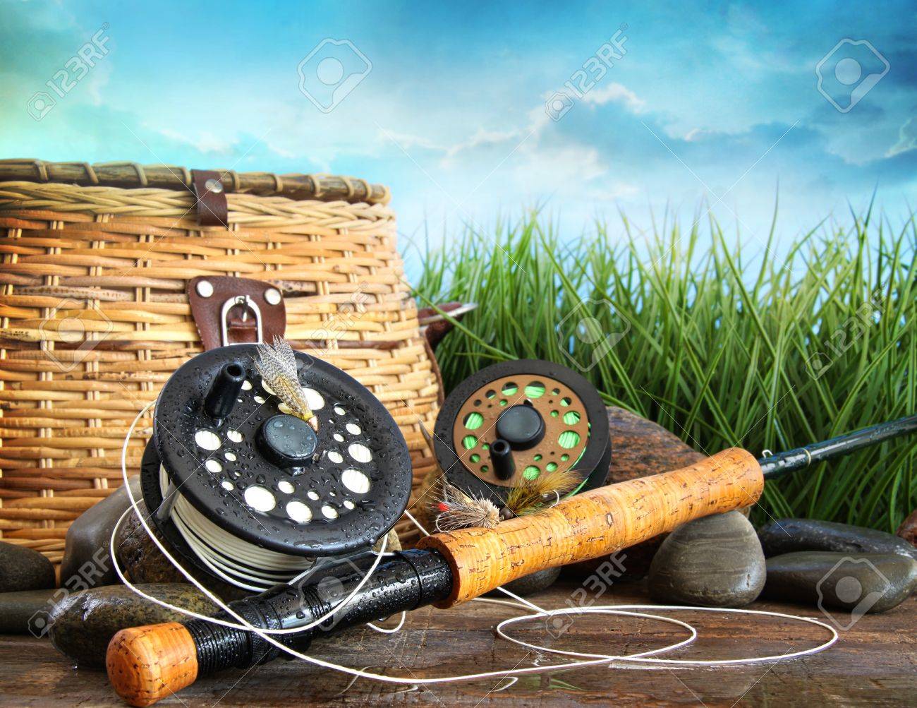 Closeup of fly fishing equipment and basket - 14878766 Closeup of fly fishing equipment and basket - 14878766