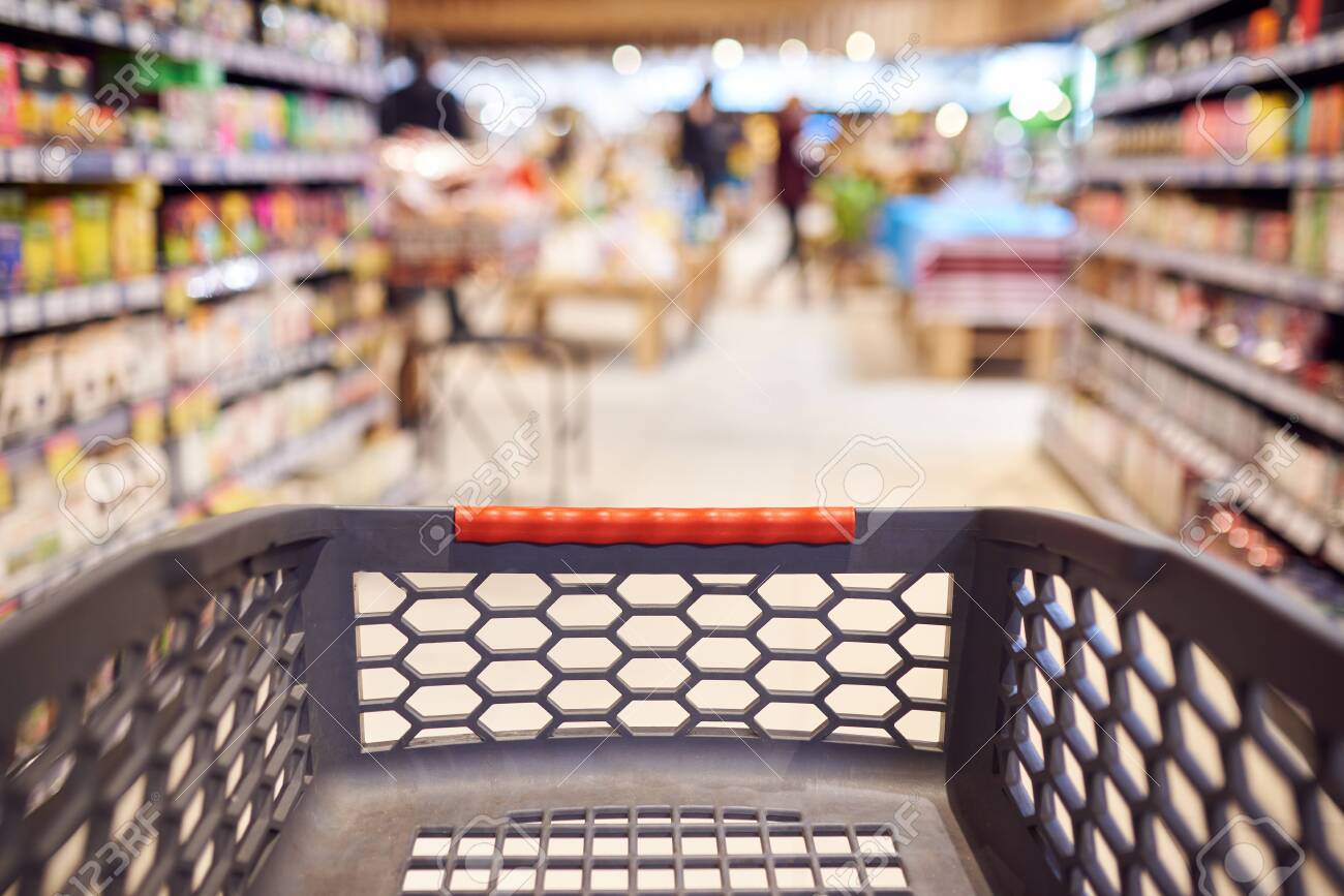 Abstract blurred photo of empty trolley in supermarket bokeh background. Empty shopping cart in supermarket. - 144401754 Abstract blurred photo of empty trolley in supermarket bokeh background. Empty shopping cart in supermarket. - 144401754