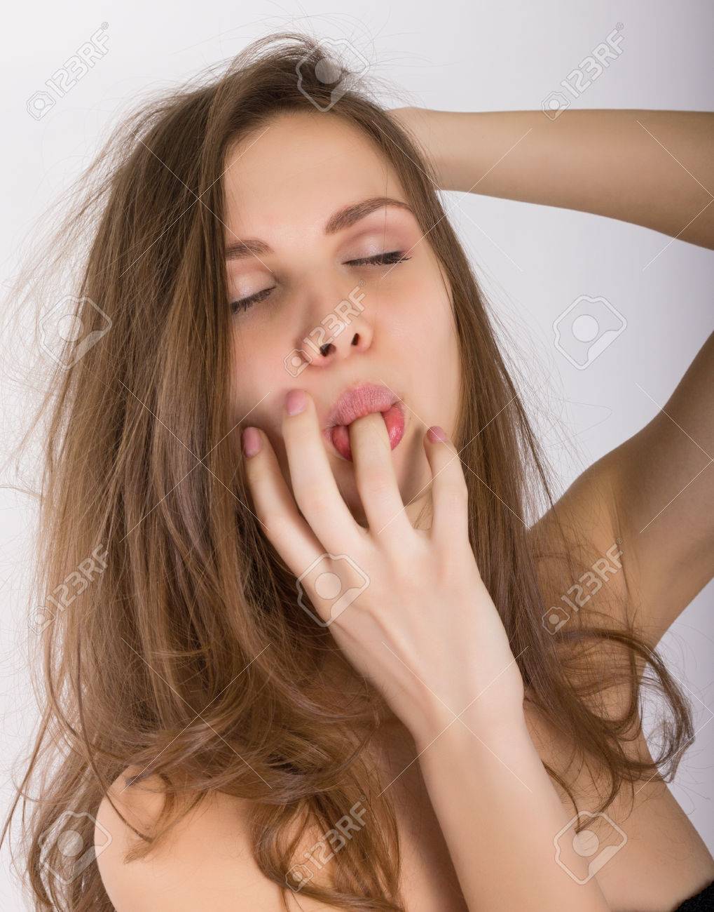 Close-up Portrait Of Sexy Blonde Girl Sucks His Ring Finger. Фотография,  картинки, изображения и сток-фотография без роялти. Image 55356048