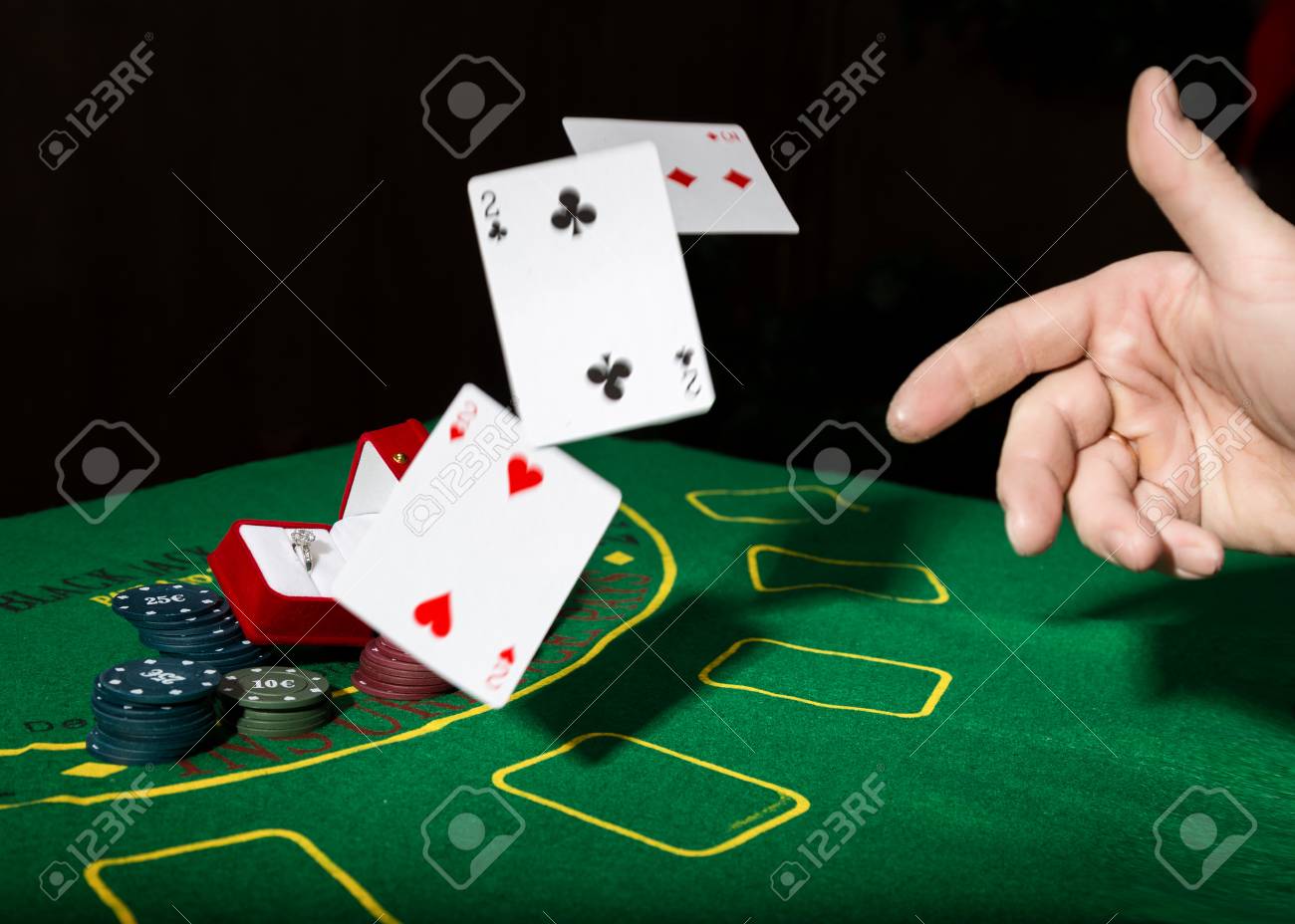 Casino Chips And A Precious Ring On A Green Poker Table Background Man Throws Cards With Losing Combination Stock Photo Picture And Royalty Free Image Image 68612764