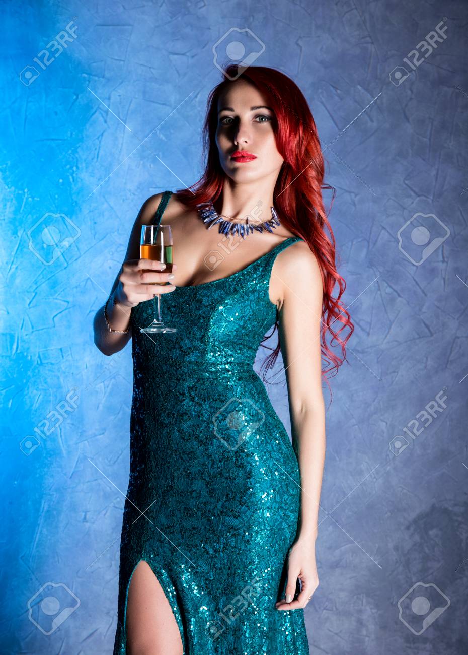 Young Sexy Woman With Big Boobs In Blue Elegant Dress Holding Wineglass  With Champagne Stock Photo, Picture And Royalty Free Image. Image 82505517.