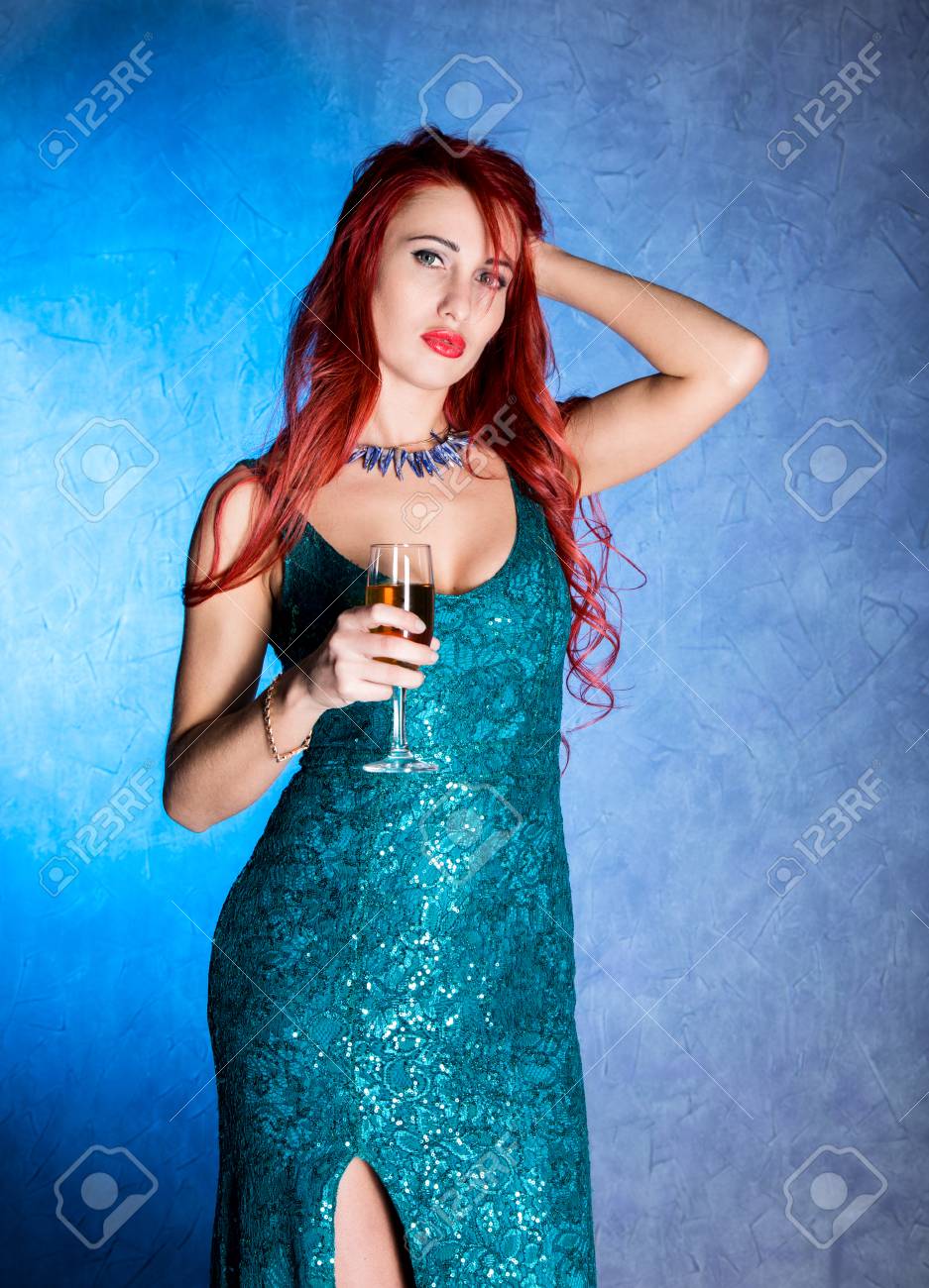 Elegant Redhead Woman With Big Tits In Tight Blue Dress Holding Wineglass  With Champagne Stock Photo, Picture and Royalty Free Image. Image 82579546.