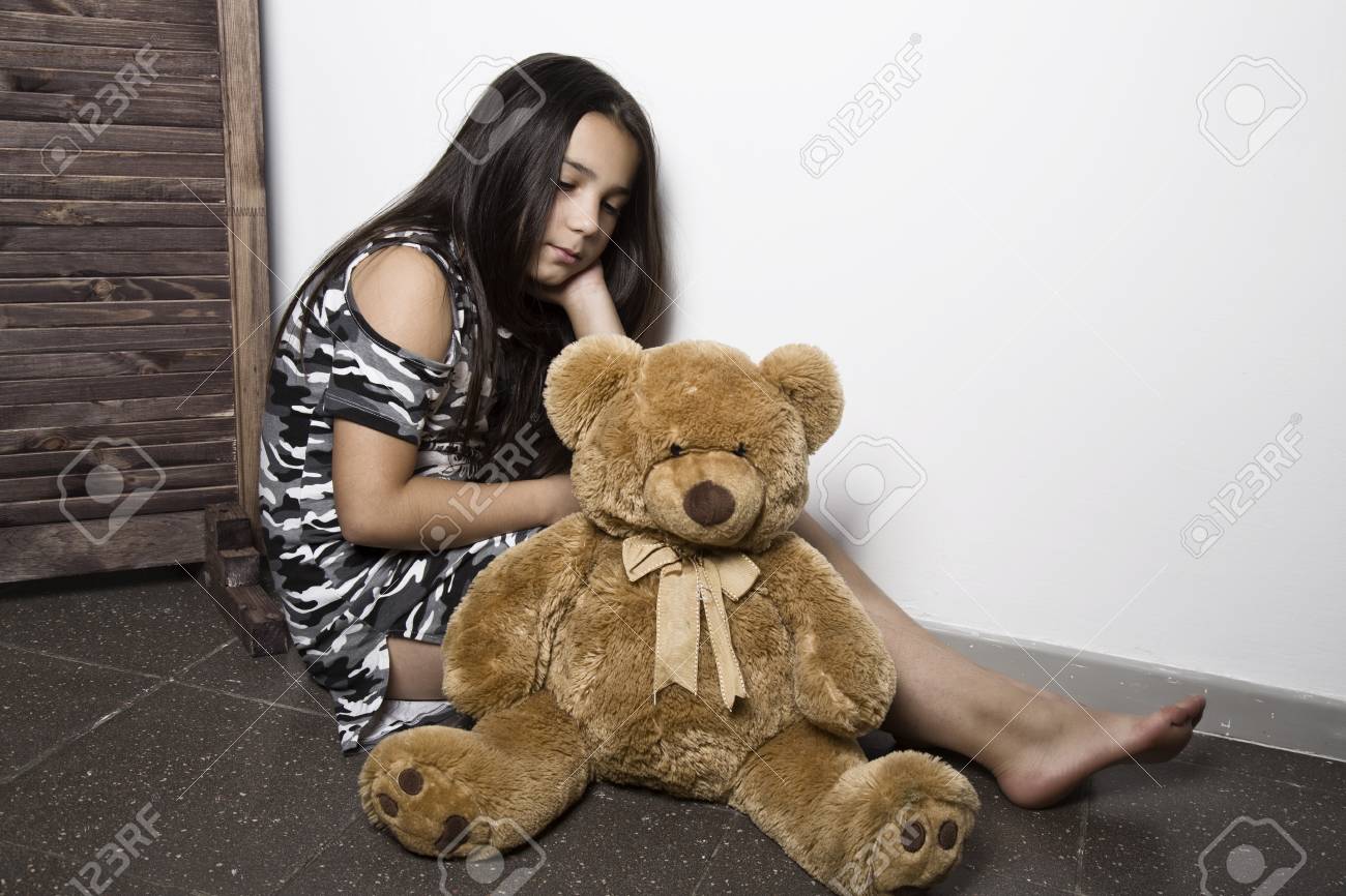 sad teddy bear with girl