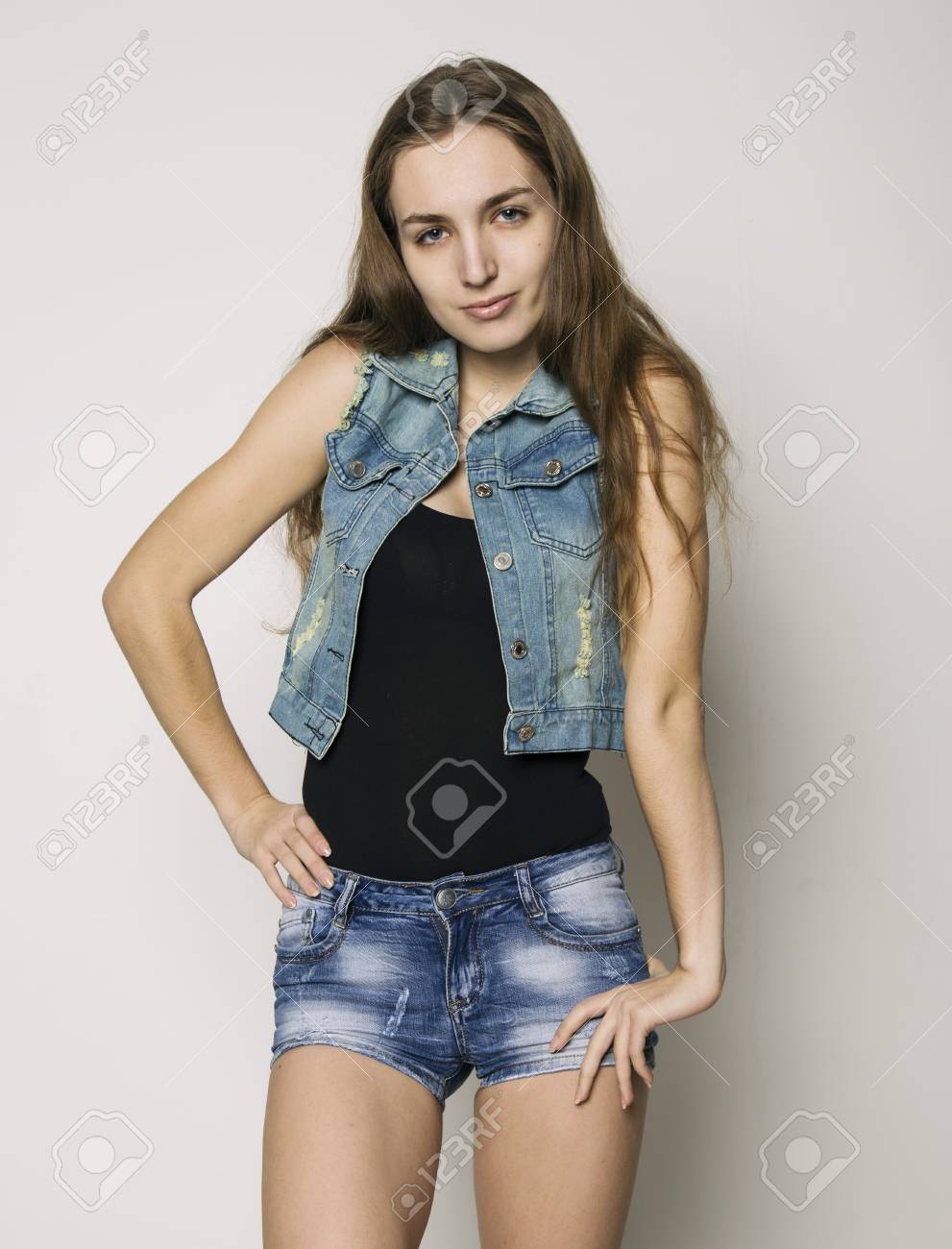 Young Beautiful Happy Stylish Hipster Girl In A Denim Jacket