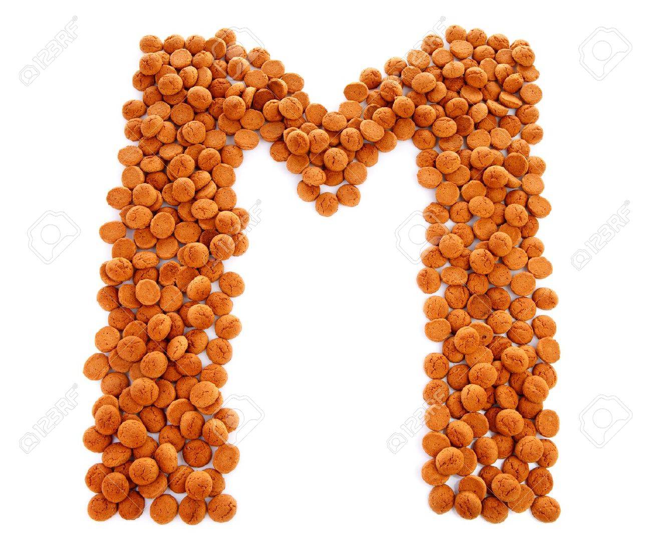 ginger nuts pepernoten in the shape of letter m isolated on food that starts with the letter m
