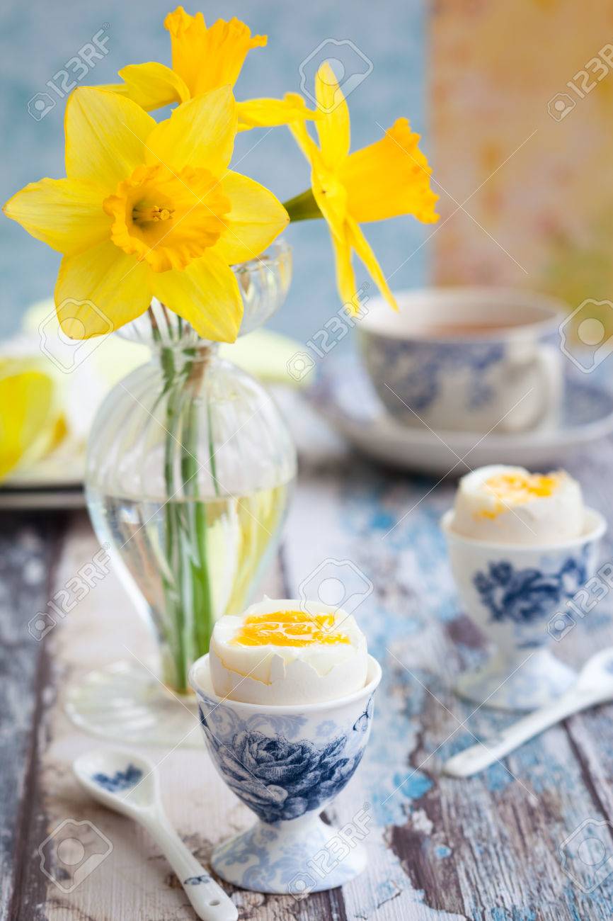 Breakfast Table Setting With Tea, Boiled Eggs And Spring Flowers ... Breakfast Table Setting With Tea, Boiled Eggs And Spring Flowers ...