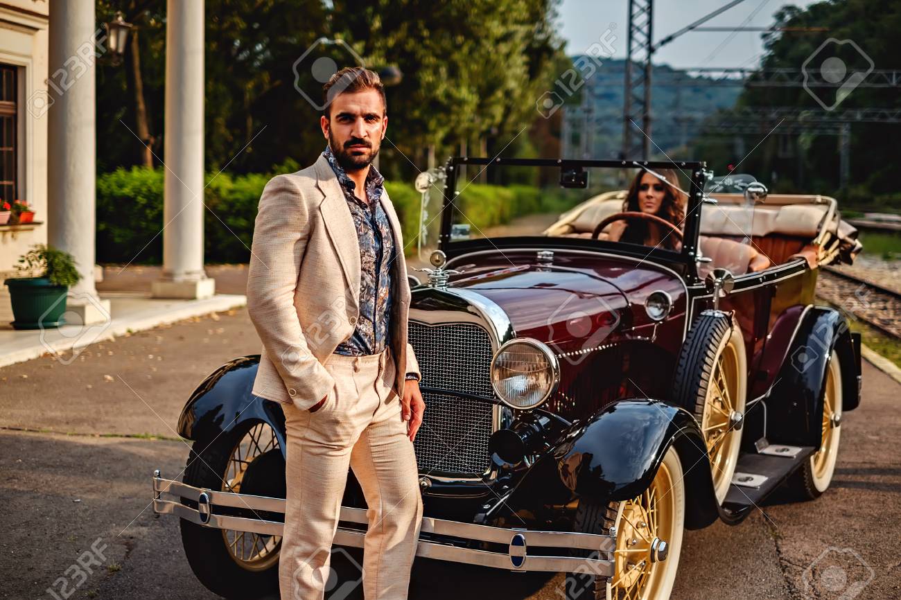Man Standing In Front Of A Woman In A Classic Car Hot Summer Day Stock Photo Picture And Royalty Free Image Image 63276244