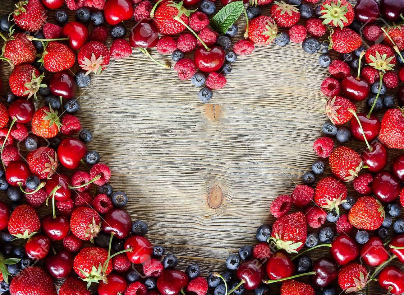 Fresh ripe berries, cherries, raspberries, blueberries copy space background, summer fruits, harvest concept, vitamins food, heart shaped - 41906003 Fresh ripe berries, cherries, raspberries, blueberries copy space background, summer fruits, harvest concept, vitamins food, heart shaped - 41906003