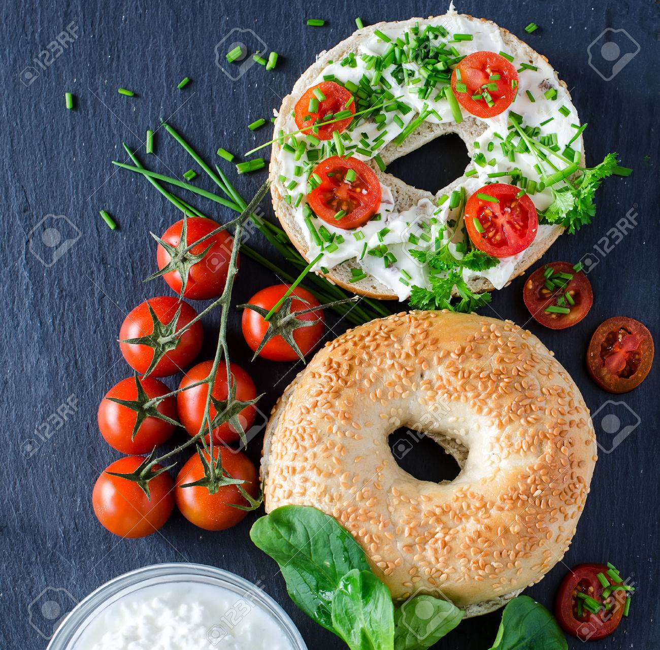 Bagels sandwiches with cream cheese, tomatoes and chives for healthy snack - 42641500 Bagels sandwiches with cream cheese, tomatoes and chives for healthy snack - 42641500