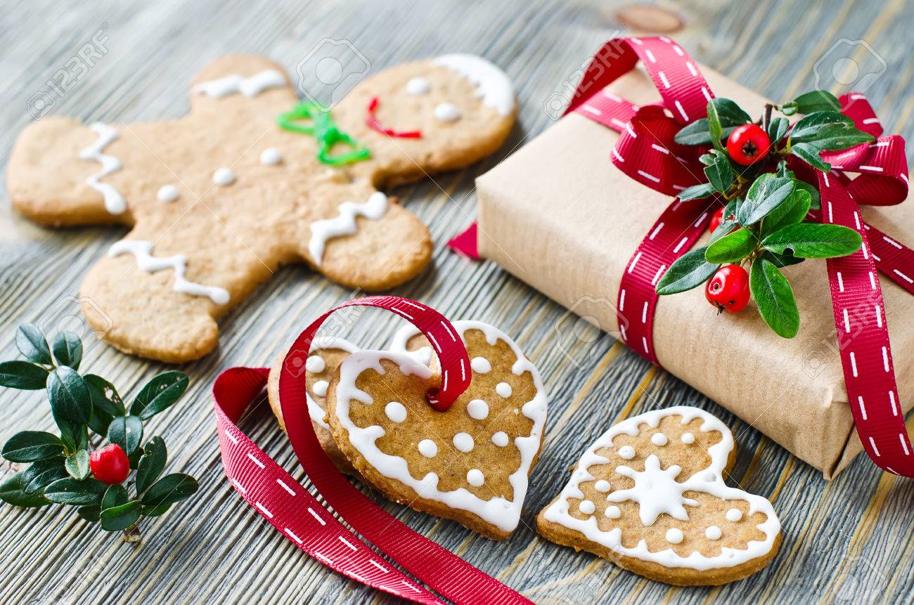Gingerman and heart shaped cookies with icing decoration and a present box - 47415597 Gingerman and heart shaped cookies with icing decoration and a present box - 47415597