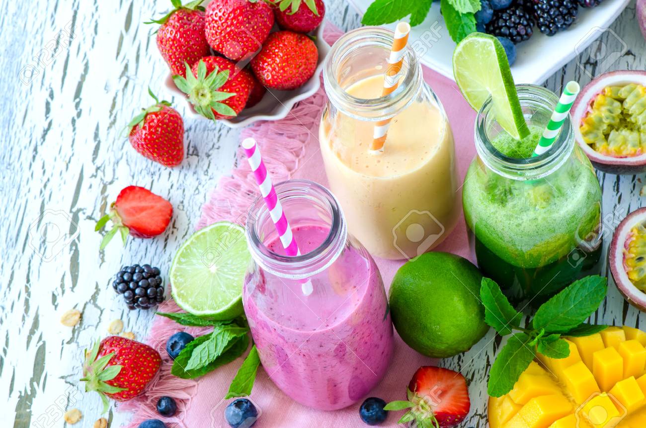 Berry and fruit smoothie in bottles, healthy summer detox yogurt drink, diet or vegan food concept, fresh vitamins, mango, lime, passtion fruits - 60638841 Berry and fruit smoothie in bottles, healthy summer detox yogurt drink, diet or vegan food concept, fresh vitamins, mango, lime, passtion fruits - 60638841